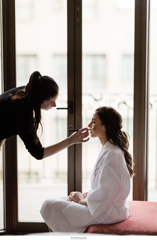 Annalisa applying makeup